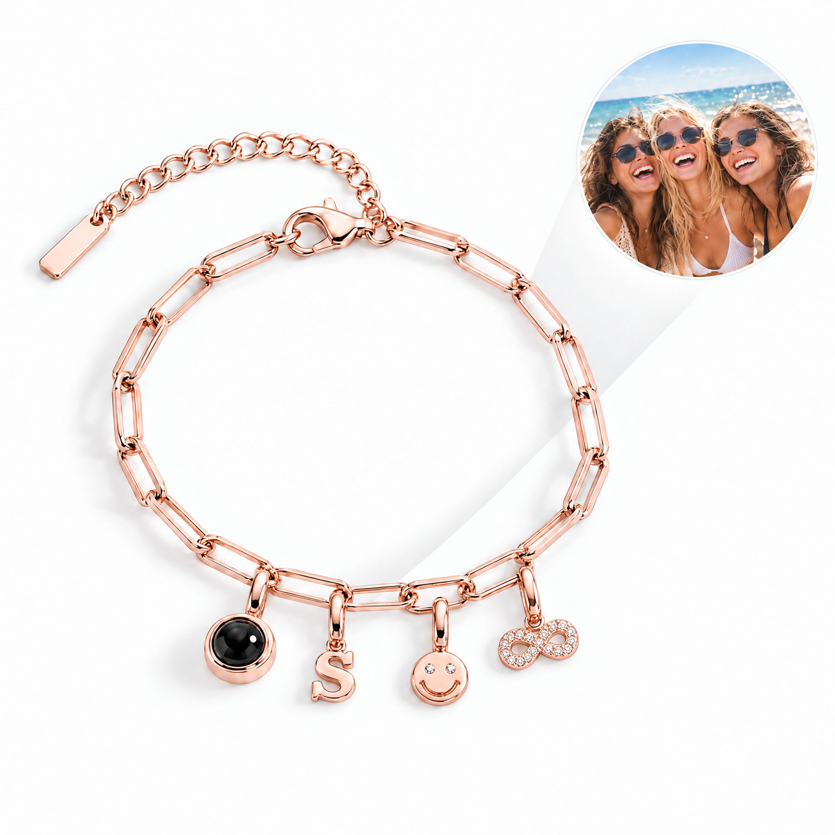 Pulsera de charms en oro rosa con charm de foto, letra s, carita sonriente e infinito