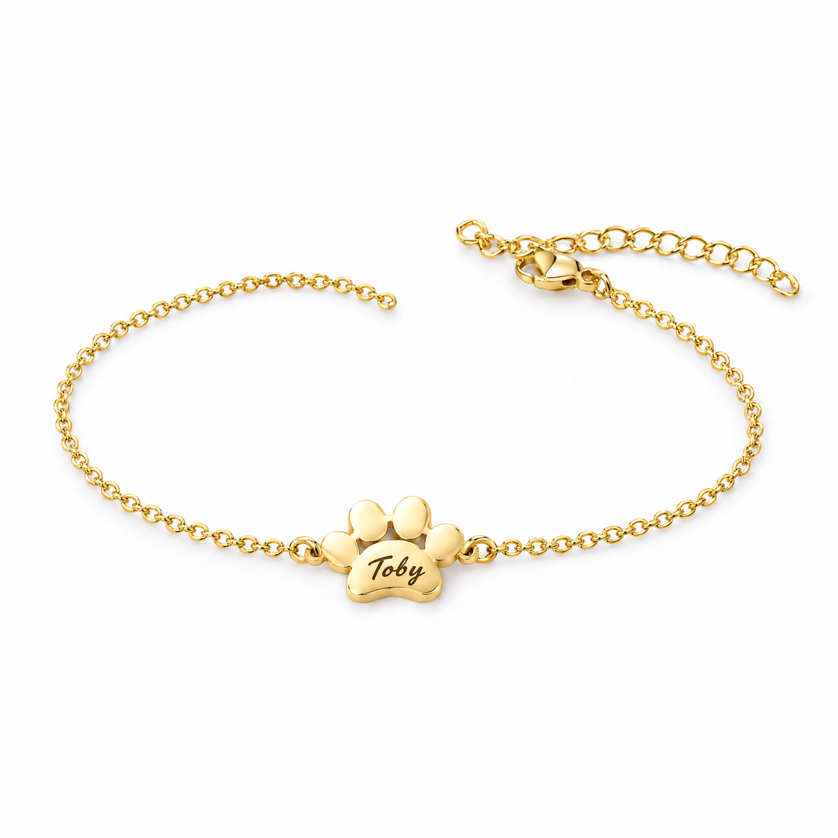 Pulsera dorada con una huella grabada con el nombre Toby